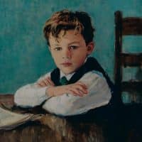 portrait of boy sitting at table